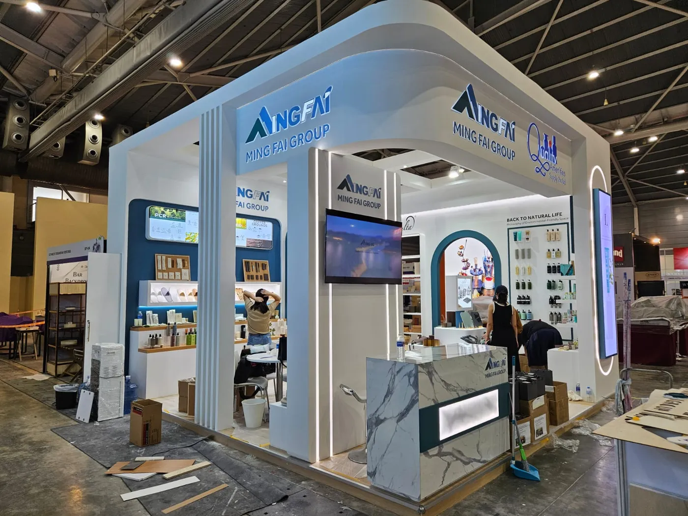 Custom exhibition booth with hospitality seating